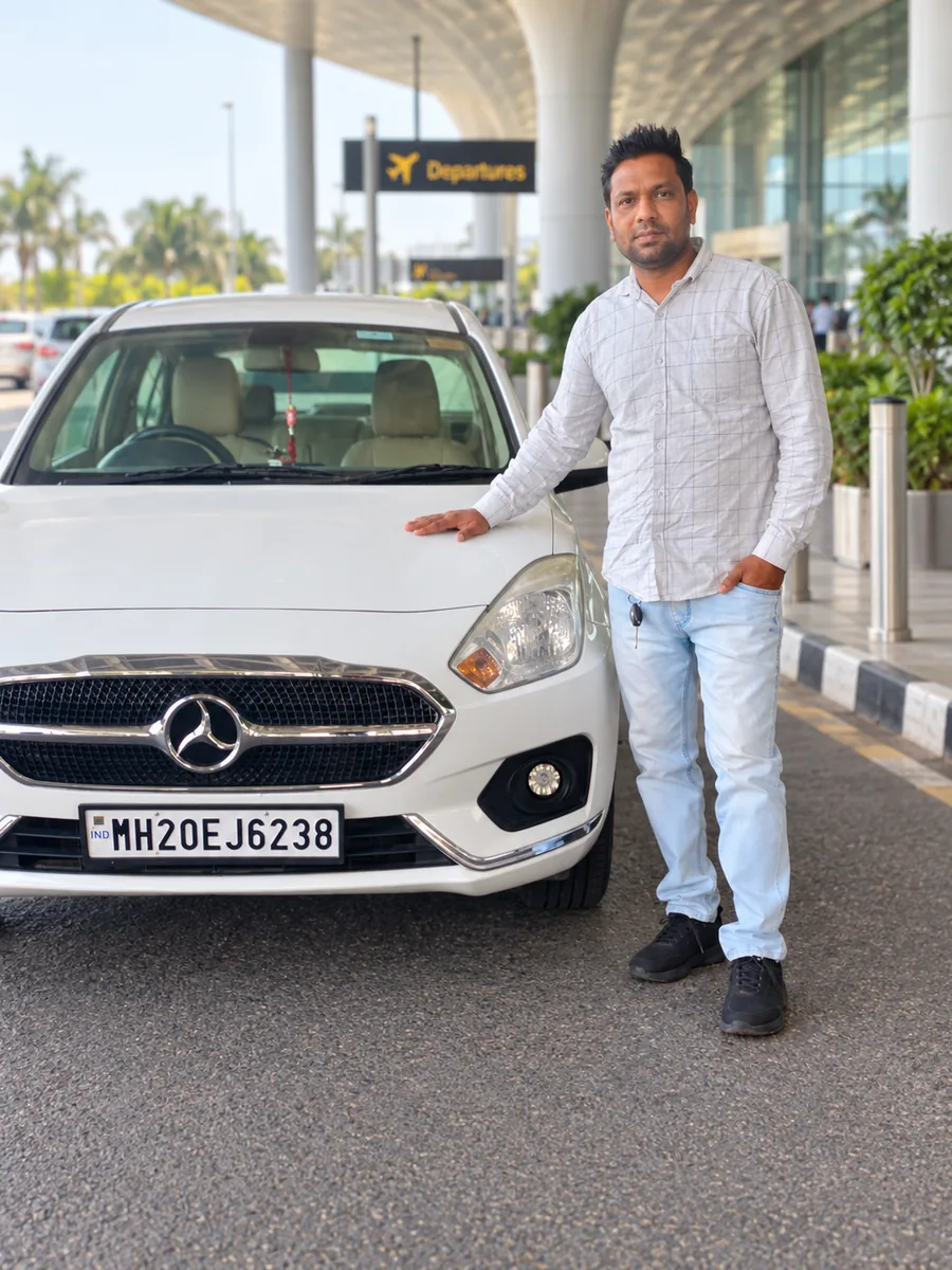 Our driver ready for airport pickup and drop at Aurangabad Airport